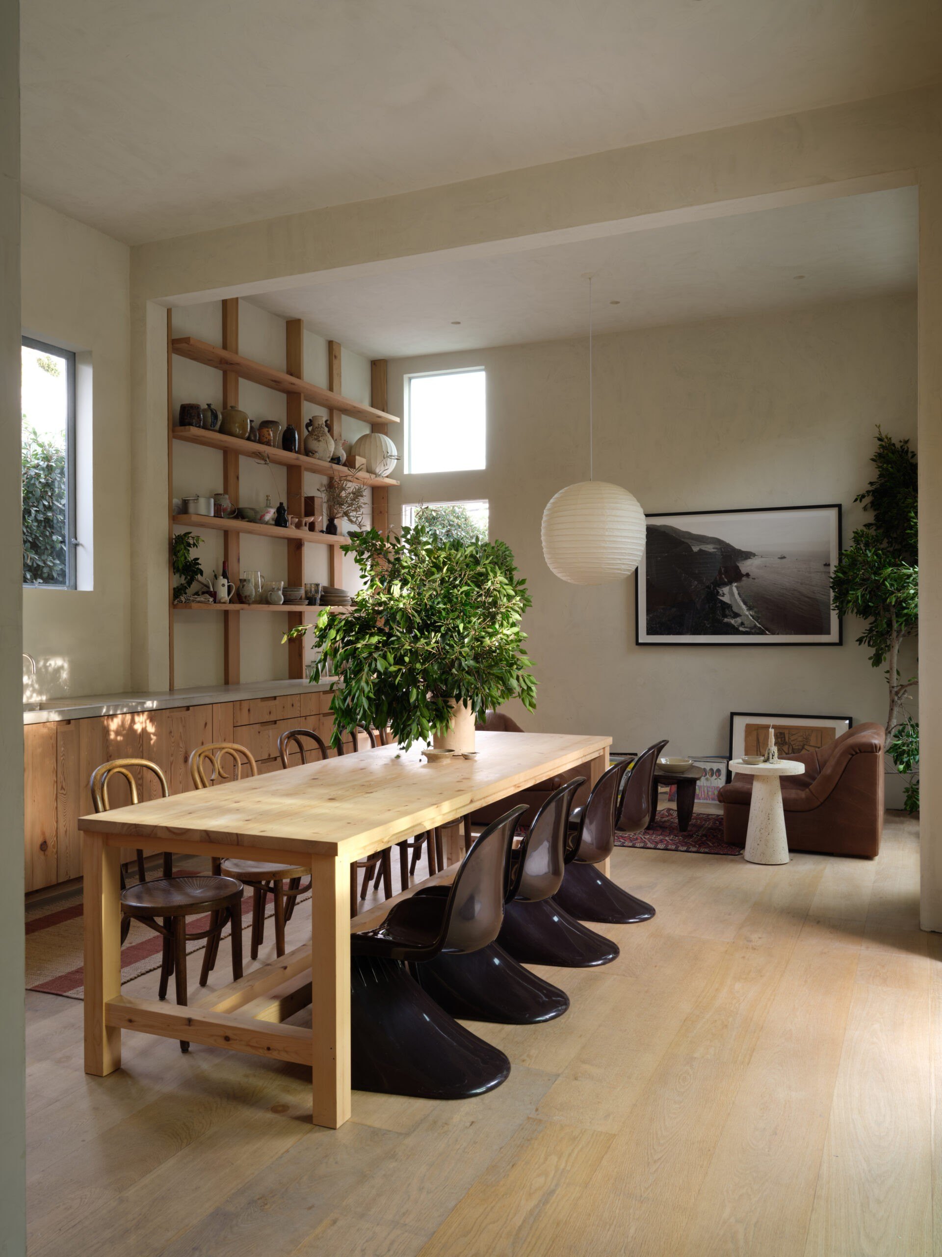 Dining table with two different types of chairs in HGTV Star Leanne Ford and Buck Mason Erik Ford Venice home