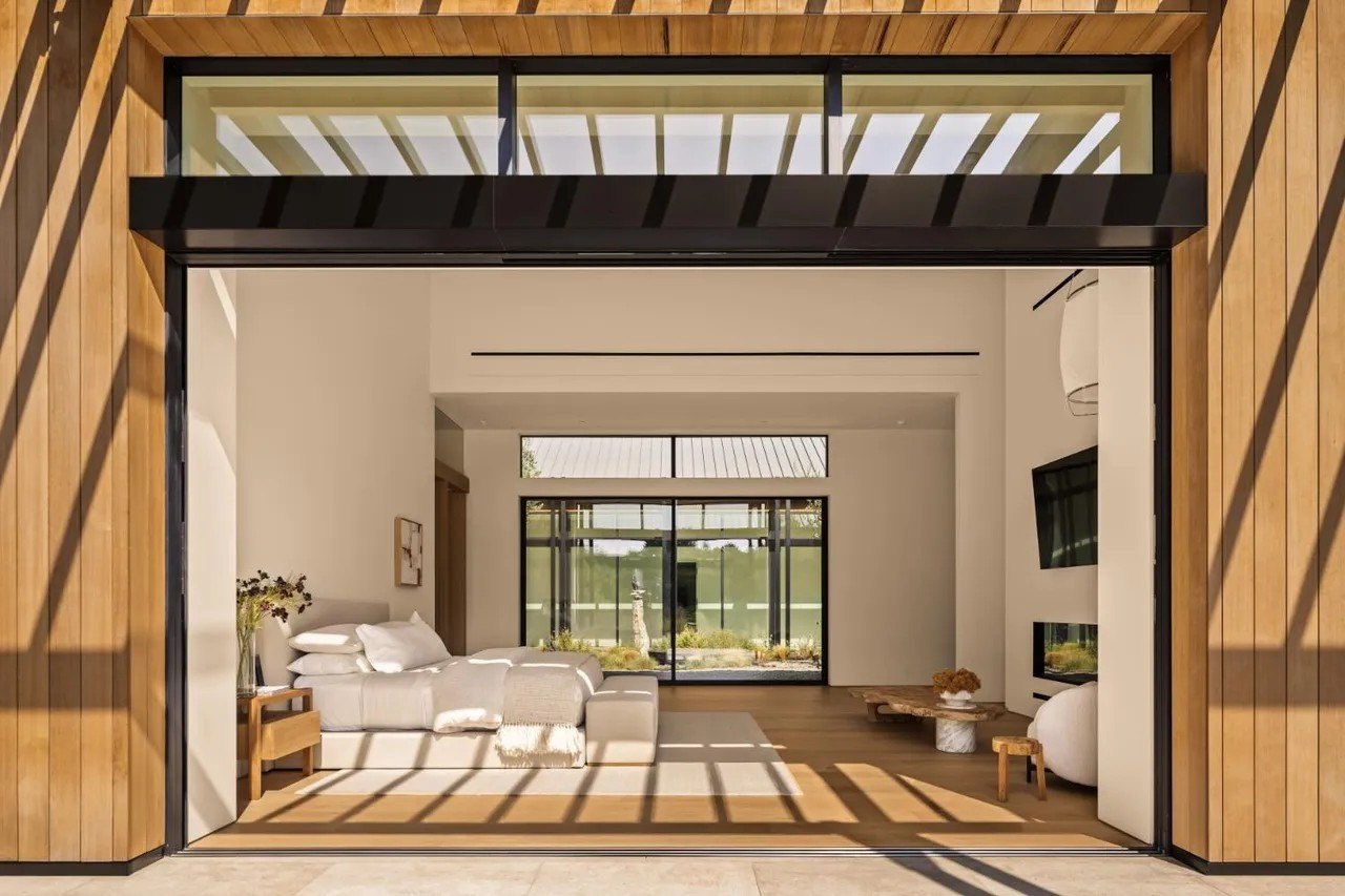 There are six bedrooms in total, two of them are primary suites, each with its own patio.