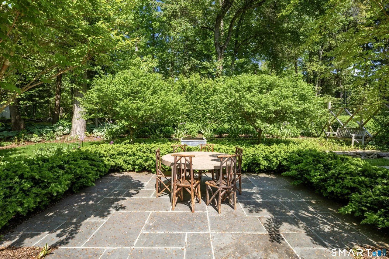 Outdoor space with a table at Paige Lorenze Connecticut home