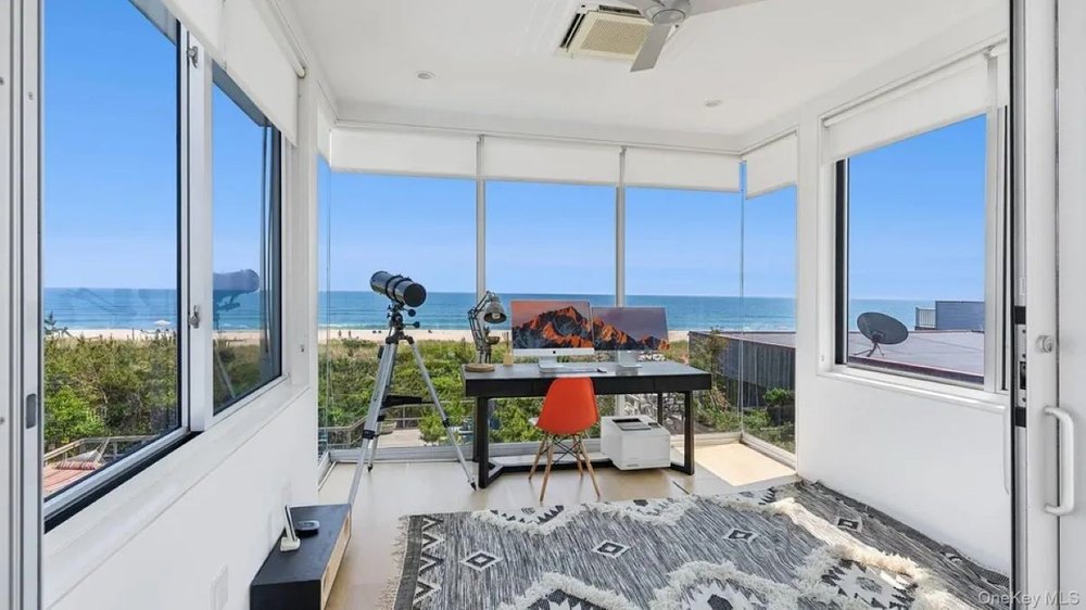 Viewing room of Crest House in Cherry Grove, NY, on sale for $3,995,000