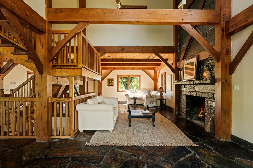 Living room of Four Mile River House in Athens, NY, on sale for $2,450,000