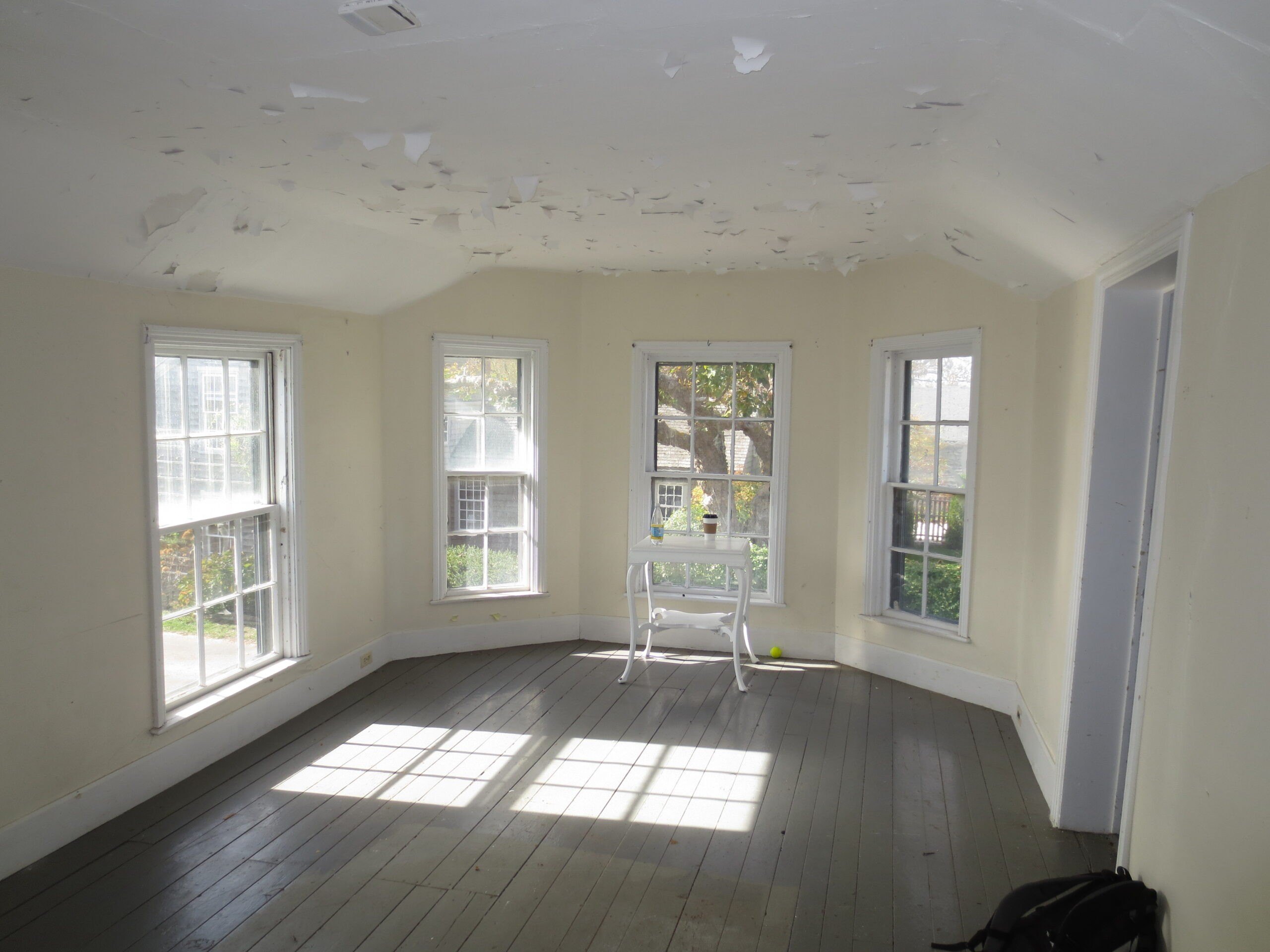 The living room had been redone with bumpy white plaster.
