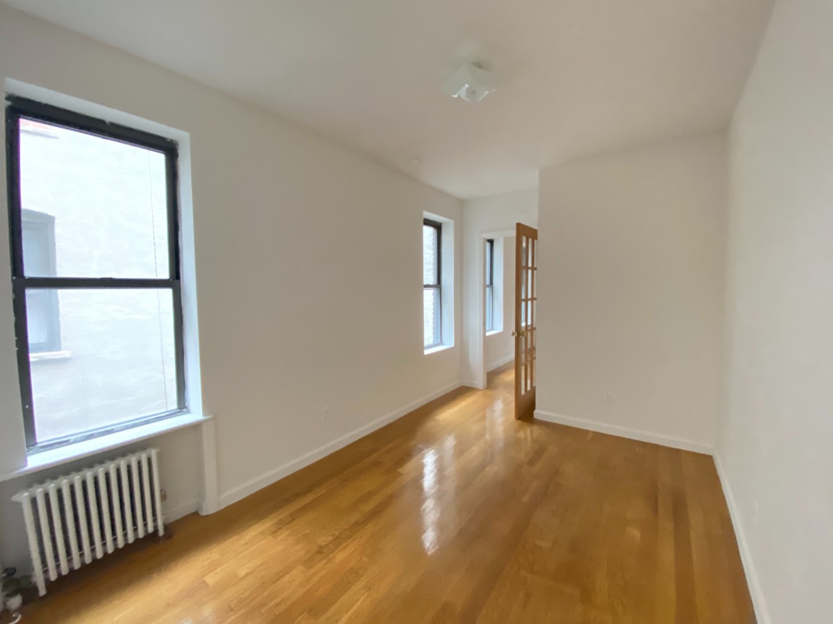 one bedroom in an apartment leading into another room