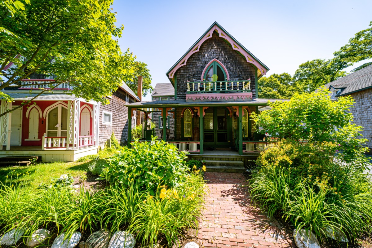 victorian gothic house with pink trim and green paint