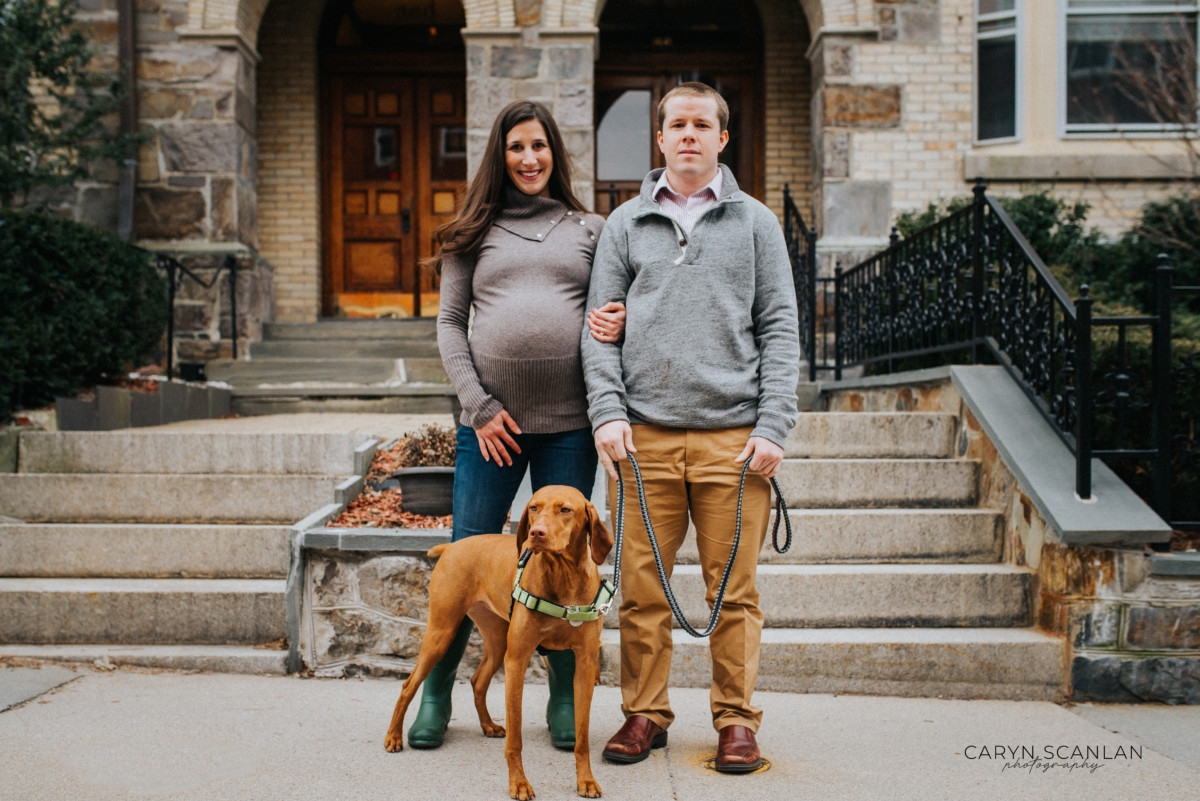 Couple with their dog outside their townhome