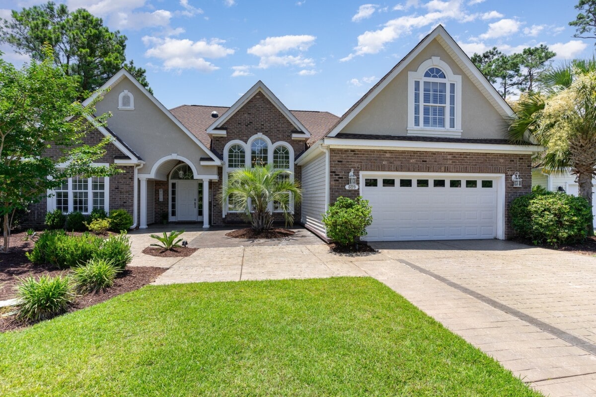 brick single family home with palm trees south carolina