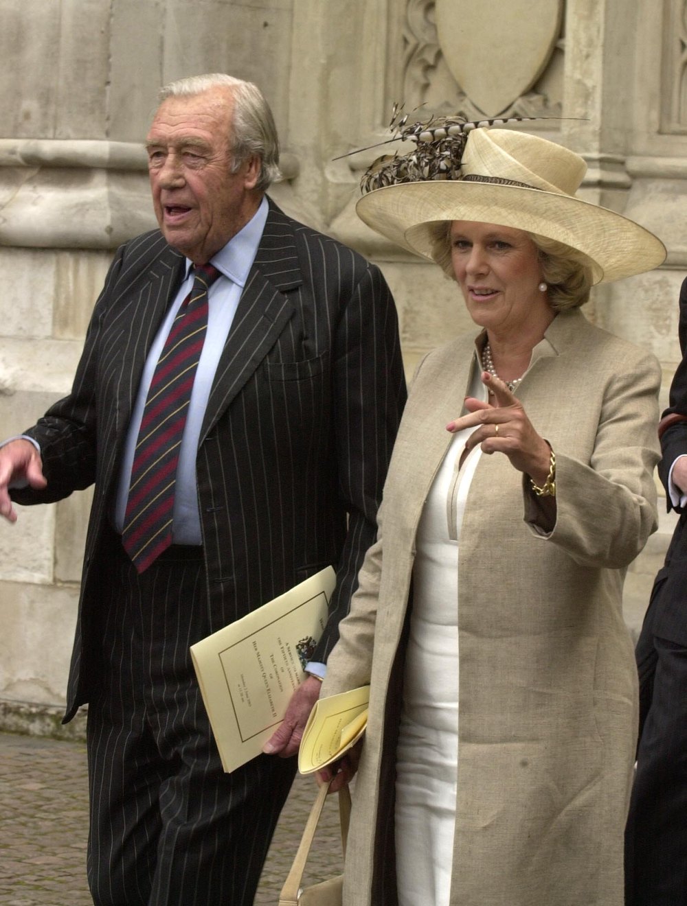 LONDON, ENGLAND - JUNE 2:  Camilla Parker Bowles, wearing a Philip Treacy hat, and her father Bruce Shand stand outside Westminster Abbey on June 2, 2003 after the ceremony to mark the 50th anniversary of the Queen's coronation in London, England. (Photo by Anwar Hussein/Getty Images)