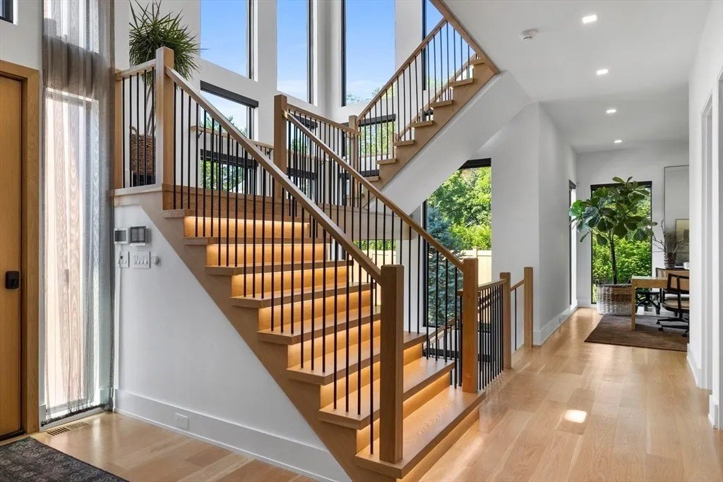 Stairs with lighting in a luxury home in Massachusetts that belongs to Jrue Holiday
