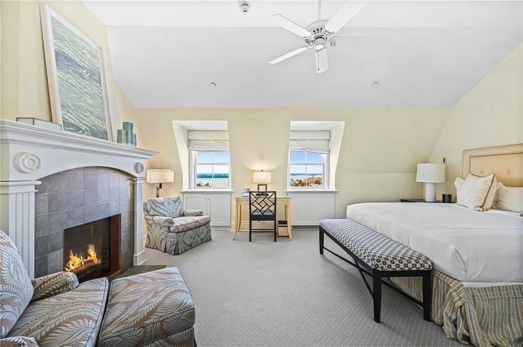 A bedroom with a fireplace in the Penthouse on top of the Ocean House in Rhode Island where Taylor Swift and Travis Kelce may be getting married