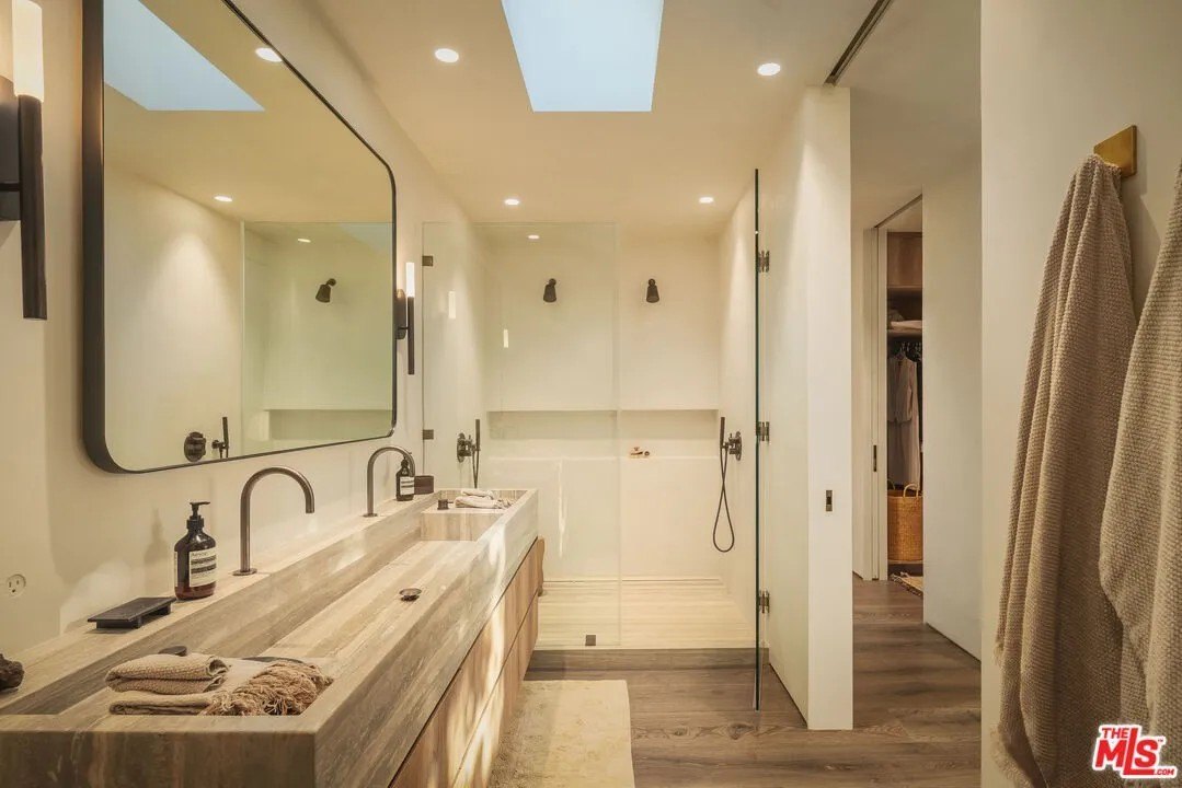 Bathroom with large shower and two shower heads in a luxury home in Malibu owned by Gal Gadot