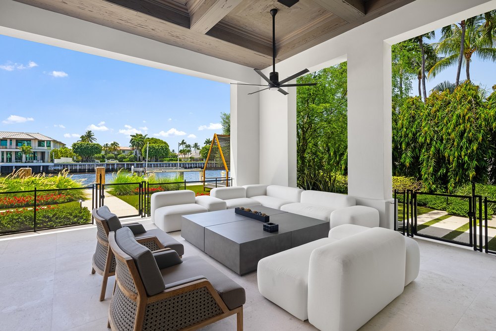 Covered Outdoor Patio Lounge with Modern Sectional and Waterfront Views