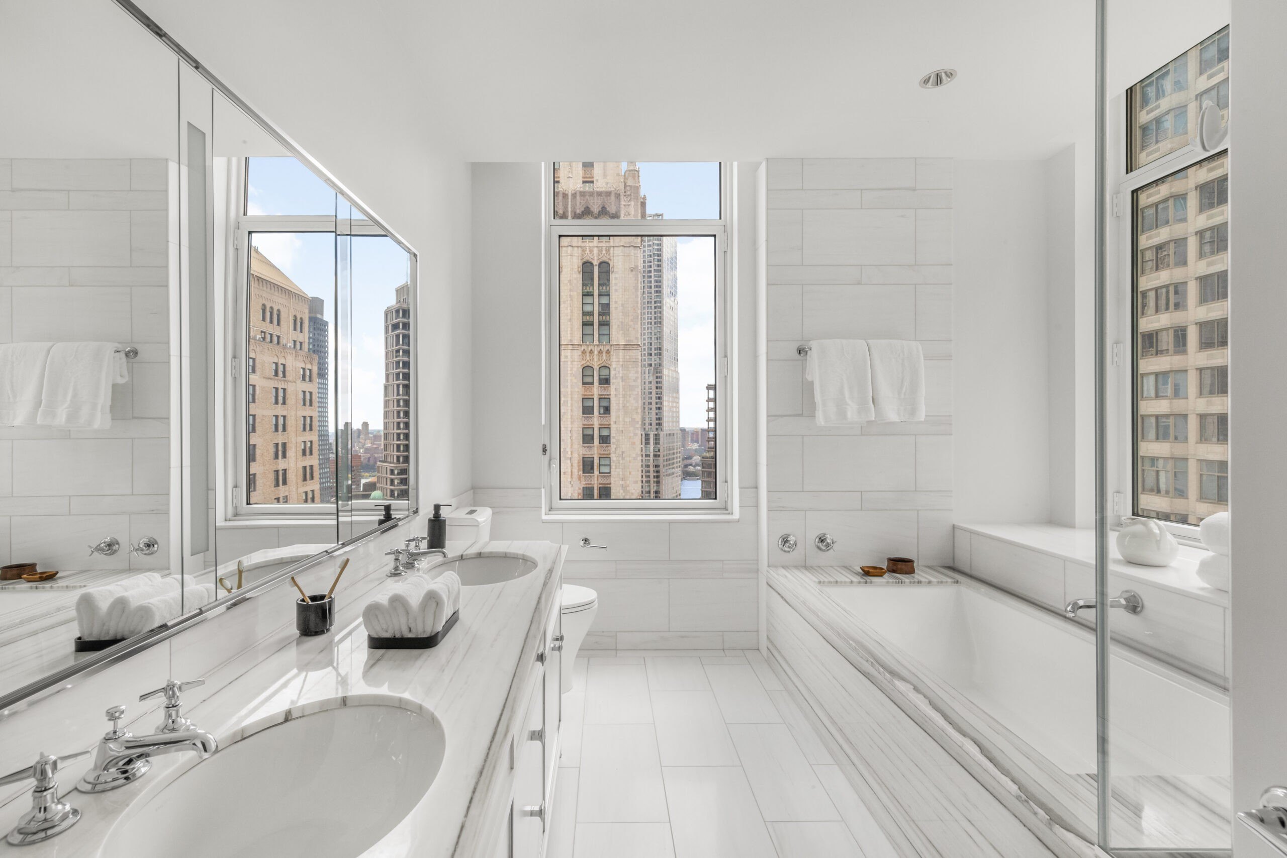 A bathroom with a tub in the Four Season Duplex in Manhattan New York