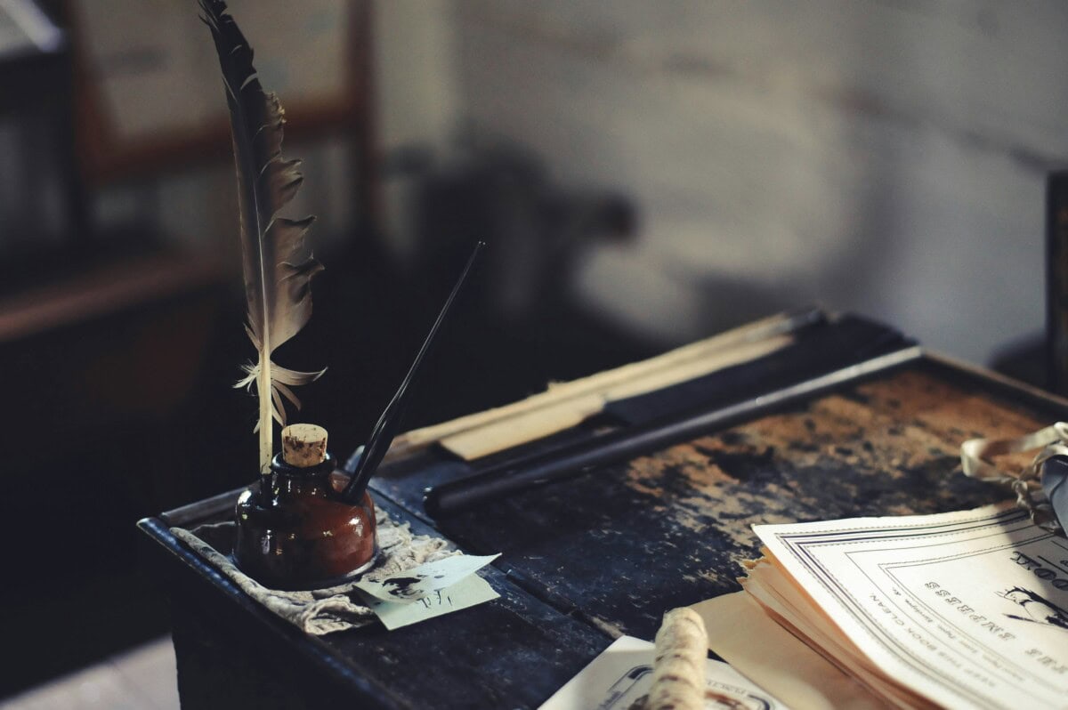 quill pen on desk