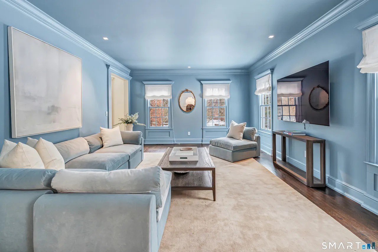 Powder Blue living room walls to ceiling in Paige Lorenze Connecticut home