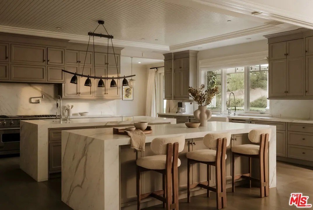 Kitchen with counter seating in a home in Hidden Hills California belonging to Kylie Jenner
