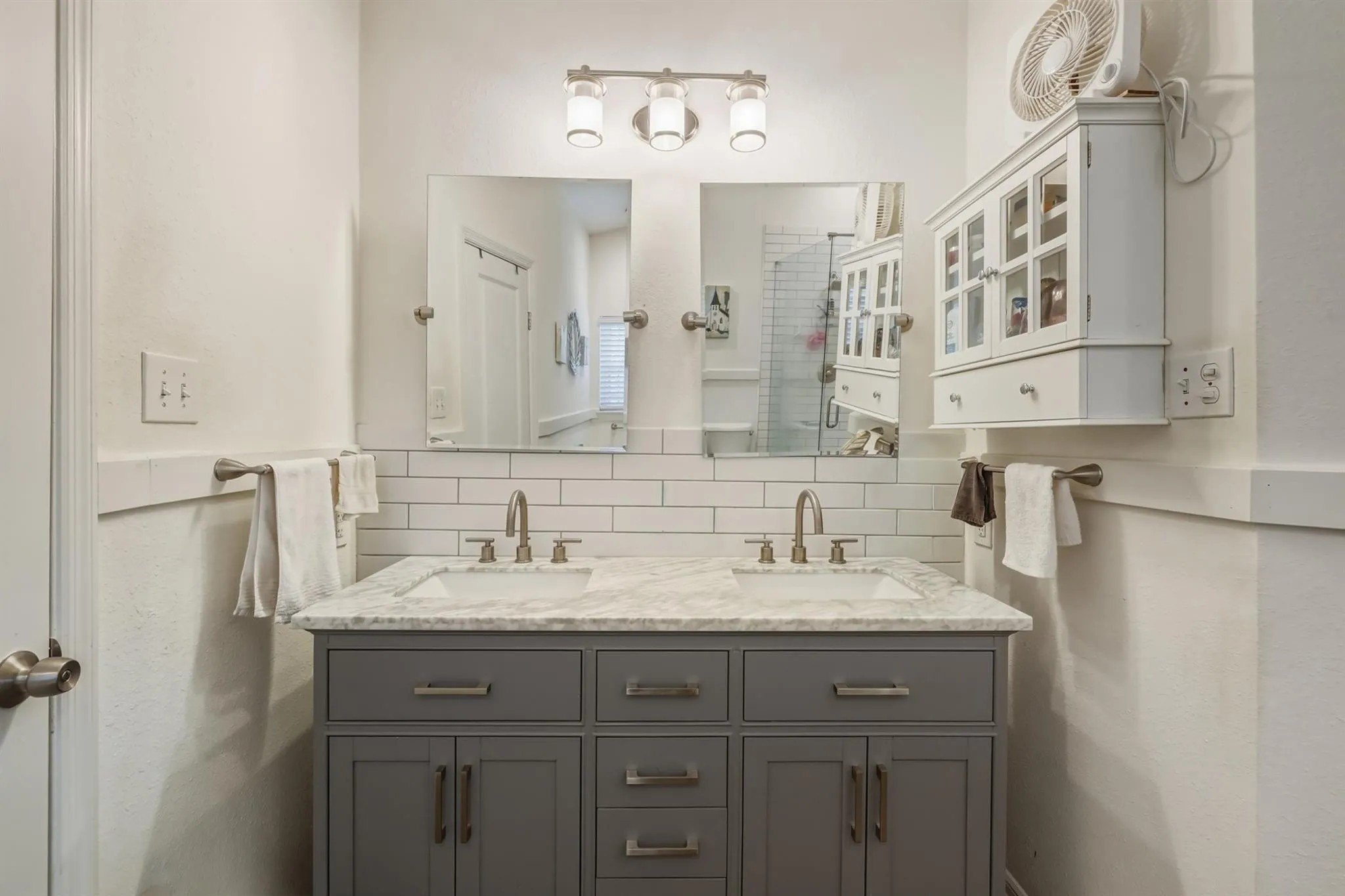 Double sinks in a bathroom at Post Malones childhood home in Texas