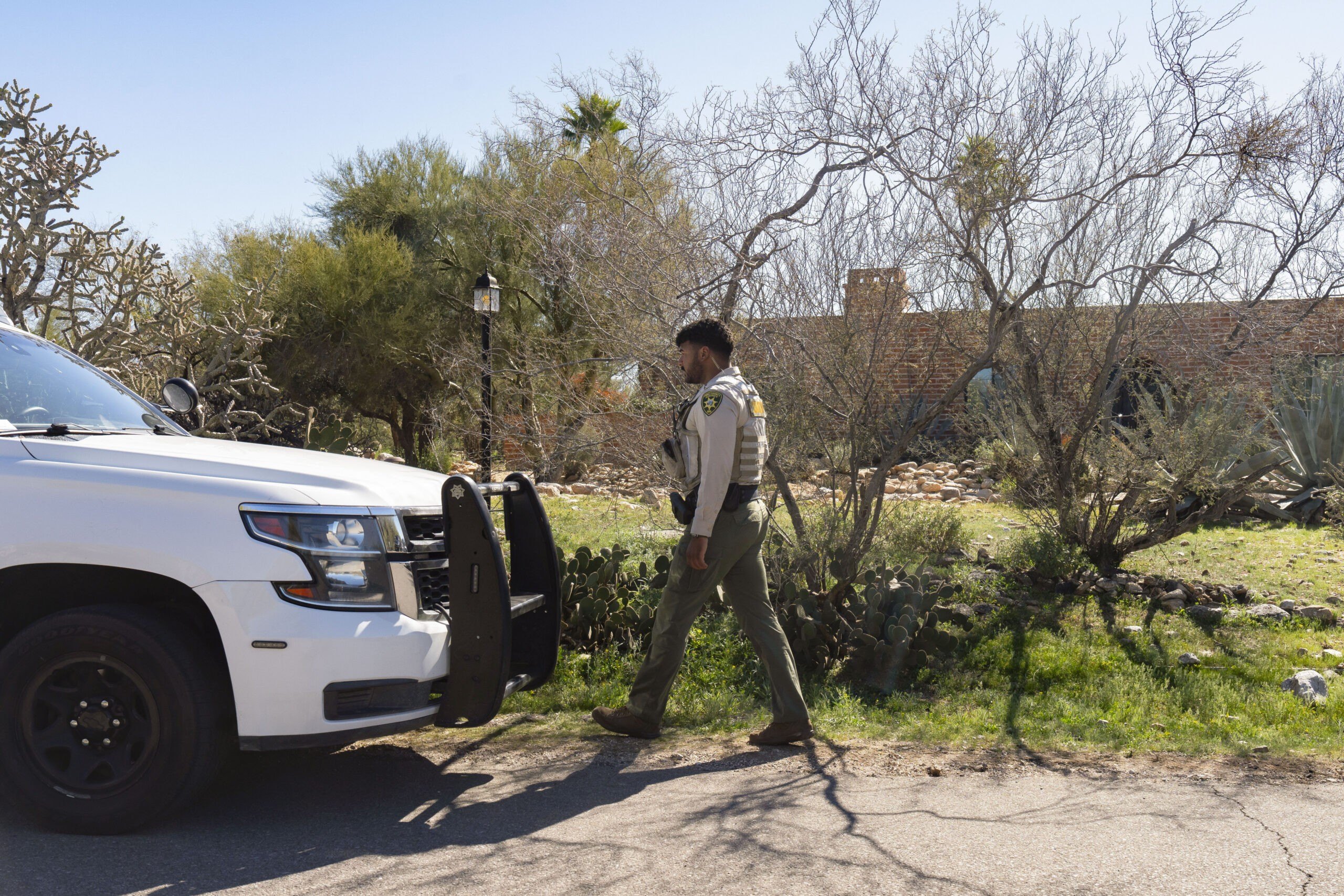 A Pima County Sheriff's Office deputy walks back to his car outside of the home of Nancy Guthrie on February 8, 2026 in Tucson, Arizona. Nancy Guthrie, the 84-year-old mother of U.S. journalist and television host Savannah Guthrie, went missing from her home in the early hours of February 1.