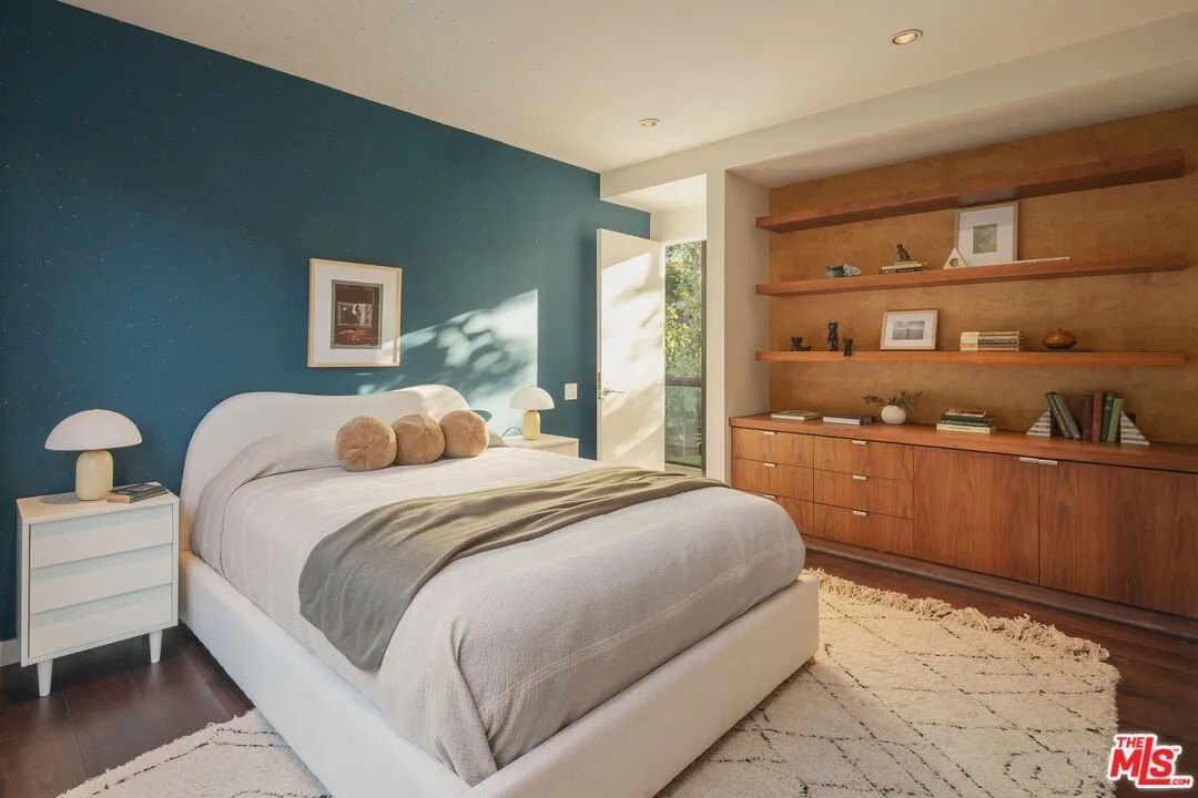 All the bedrooms are upstairs, and feature lots of light, as well as built-in shelving and cabinetry.