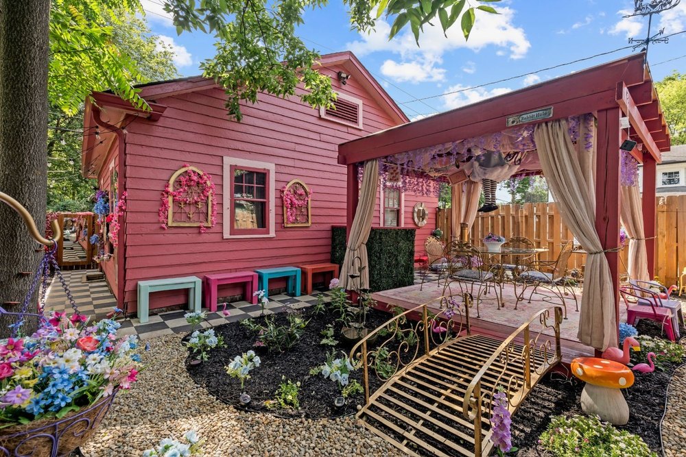 Outdoor living area of Alice in Wonderland bungalow in Indianapolis, IN, on sale for $215,000