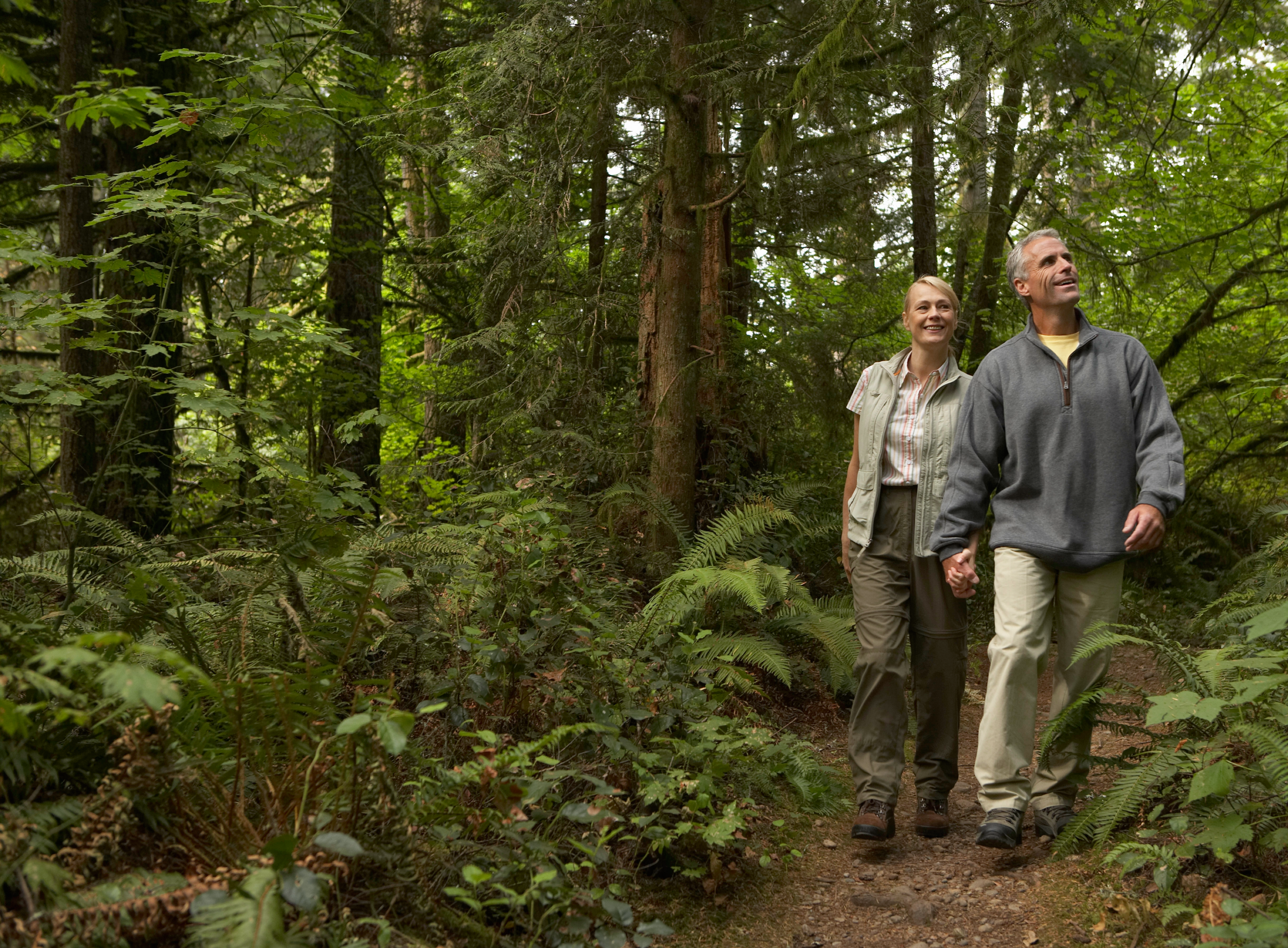 Couple walking through a trail in Rochester and Monroe County