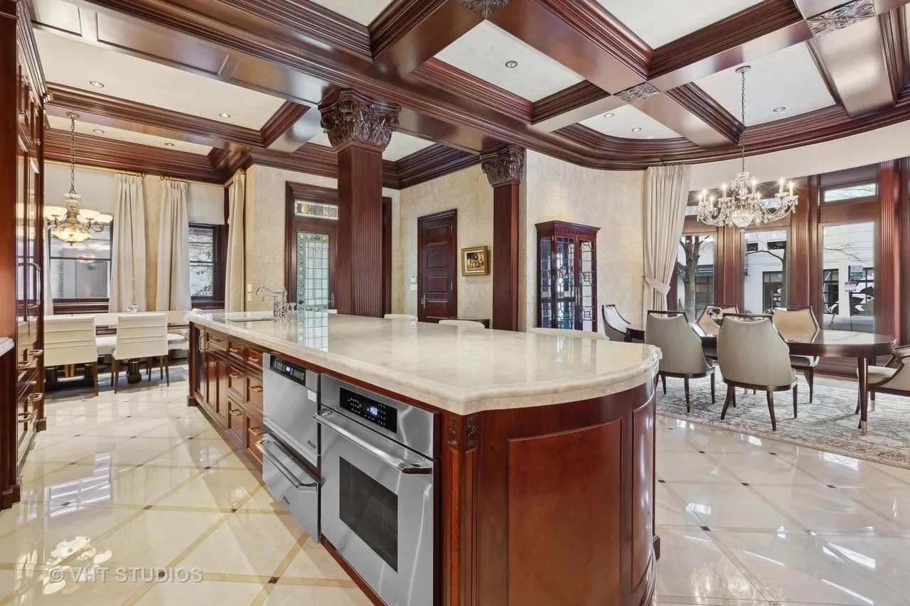 The kitchen features two large dining areas, and is a gracious mix of old and new.
