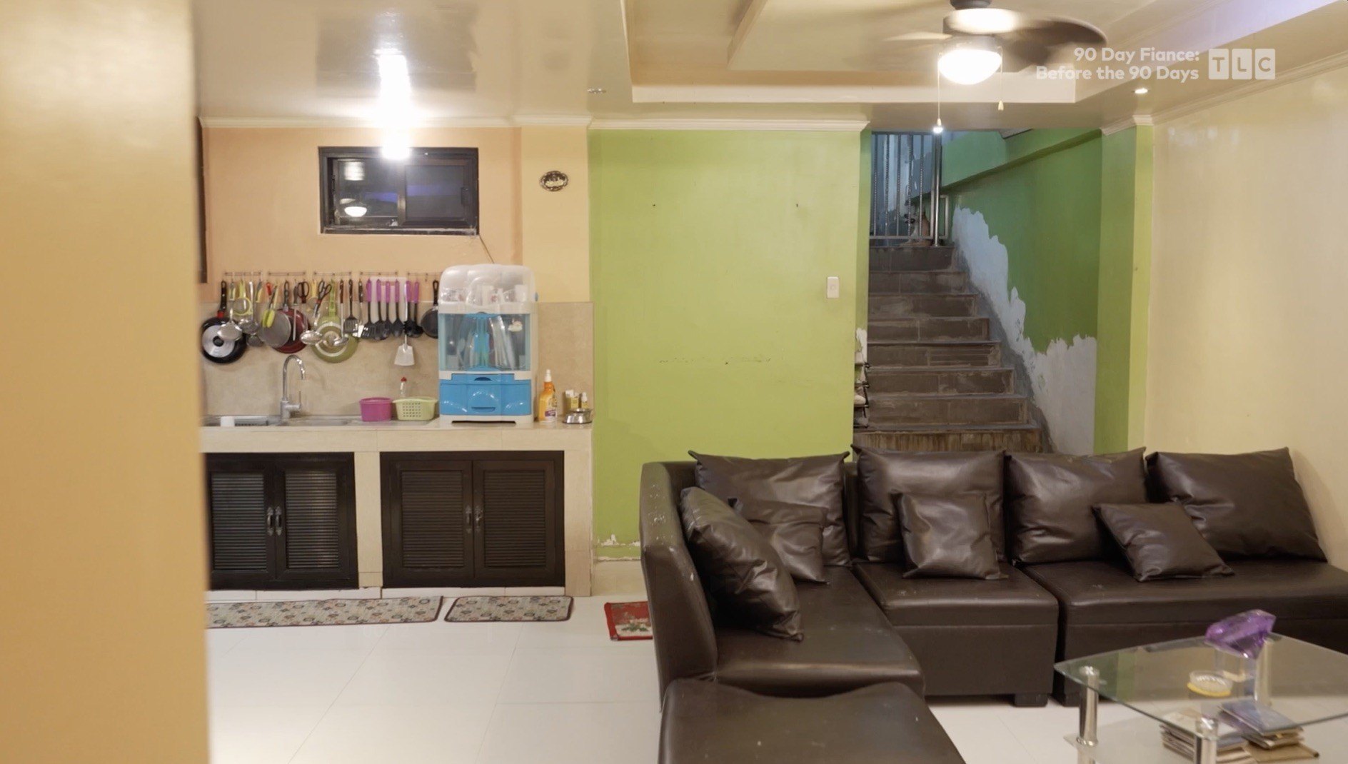 Annalyn's open concept great room uses different colored walls to delineate the kitchen from the living room area of the layout.