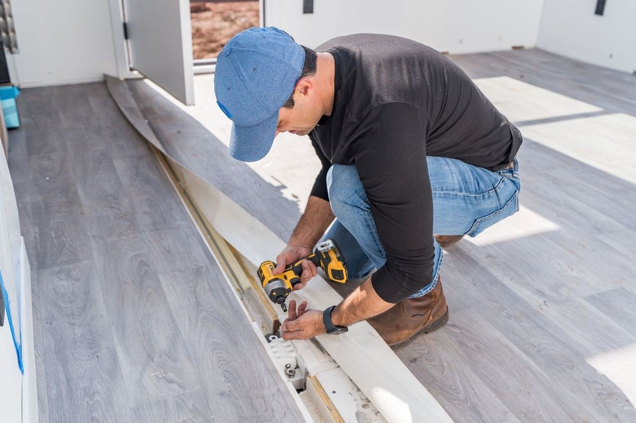 Photo of Zach Punnett working on Boxabl unit