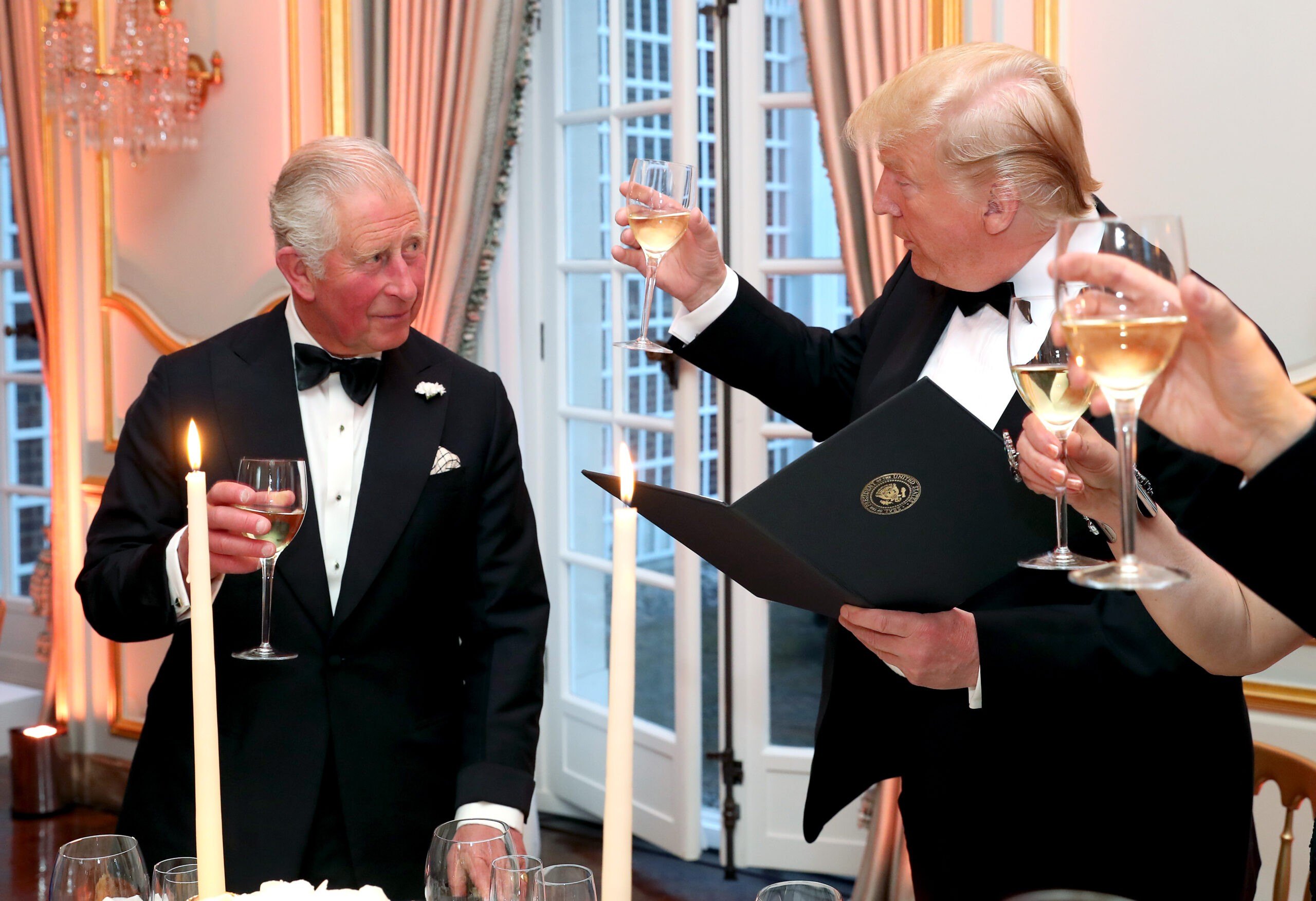 LONDON, ENGLAND - JUNE 04: US President Donald Trump (R) and First Lady Melania Trump host a dinner at Winfield House for Prince Charles, Prince of Wales (L) and Camilla, Duchess of Cornwall, during their state visit on June 04, 2019 in London, England. President Trump's three-day state visit began with lunch with the Queen, followed by a State Banquet at Buckingham Palace, whilst today he attended business meetings with the Prime Minister and the Duke of York, before traveling to Portsmouth to mark the 75th anniversary of the D-Day landings. (Photo by Chris Jackson - WPA Pool/Getty Images)