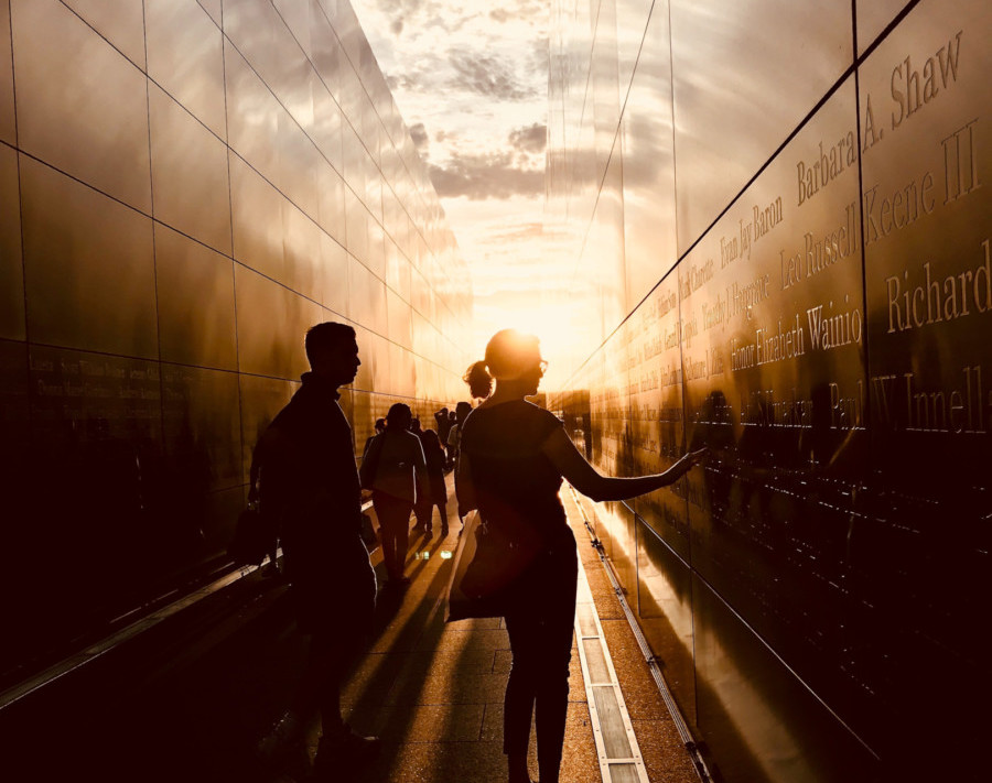 Woman touching the Veteran Memorial Wall