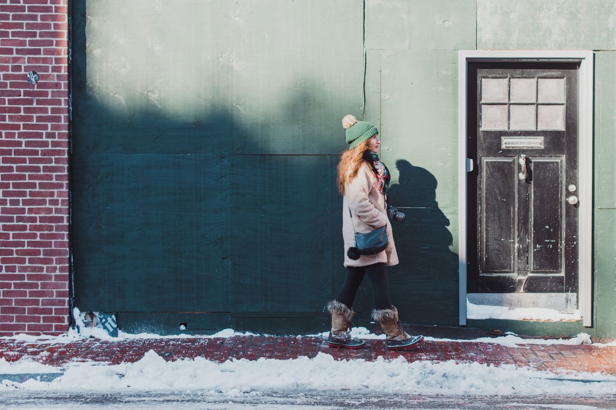 person walking through beacon hill in boston