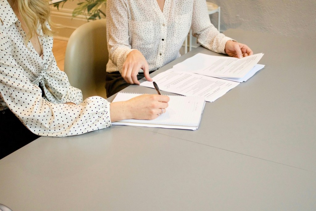 Two people closing a deal.