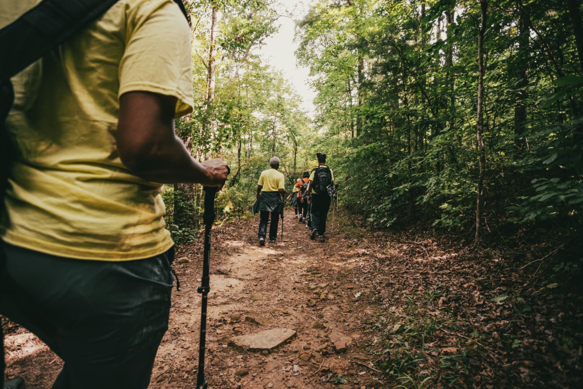 women enjoying the outdoors hiking a trail through North Georgia mountains