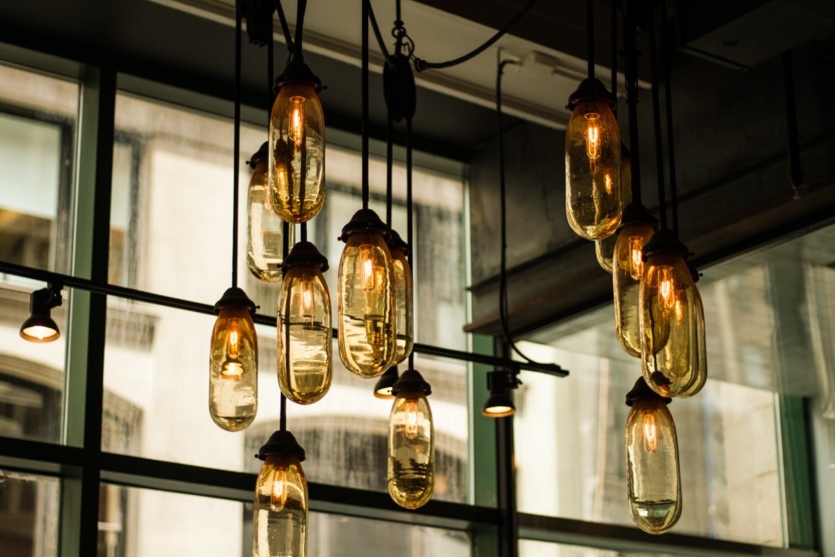 hanging light fixtures in a warehouse loft