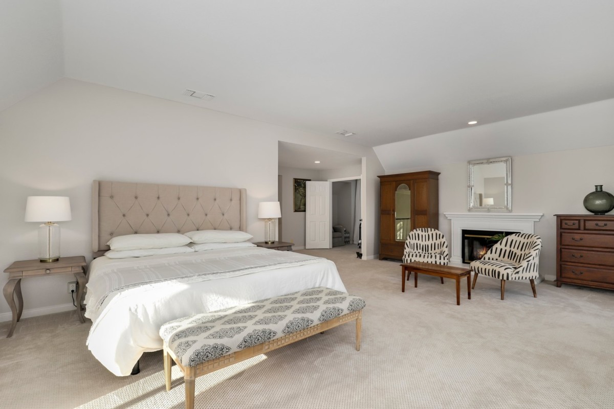 environmentally friendly carpets in a bedroom with a bed and chairs
