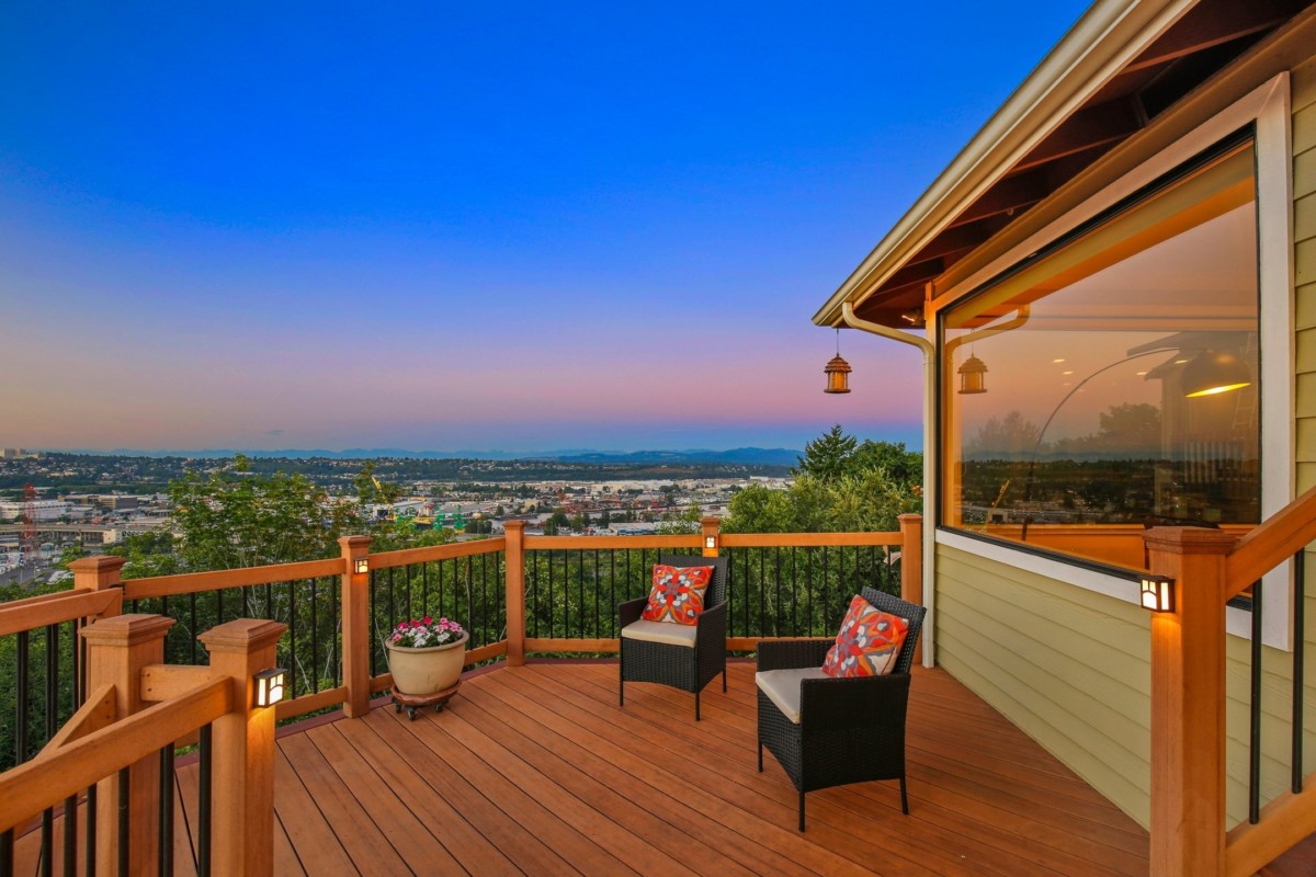 outdoor deck with views of green trees