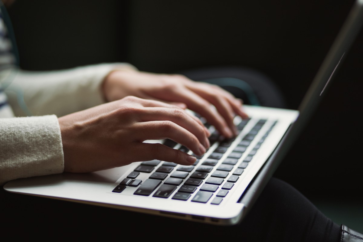 tenant typing a lease termination letter to give to their landlord
