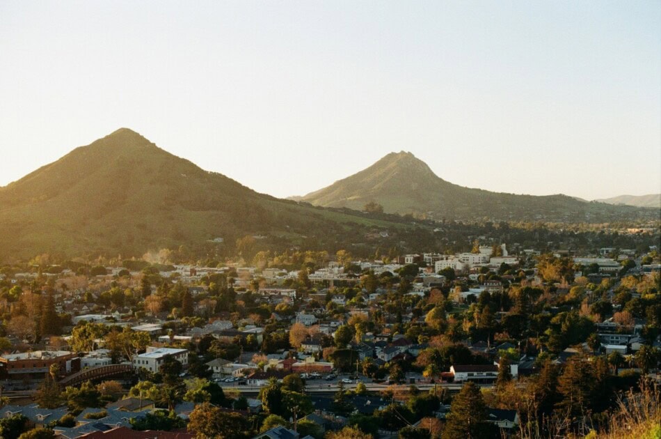 Landscape view of San Luis Obispo looking over homes with peaks in the distance