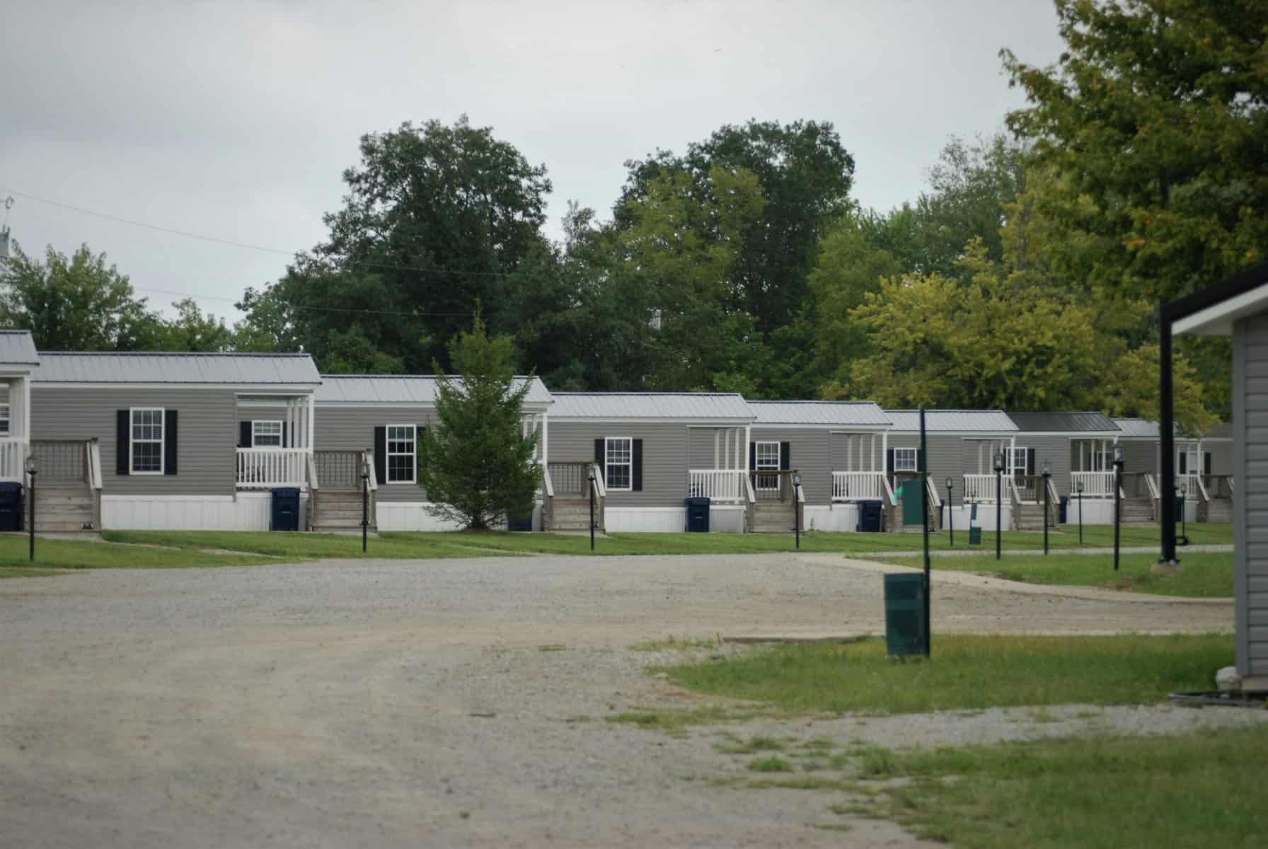 An example of what a community might look like if you are buying a mobile home. Rows of similar houses sit on a path.