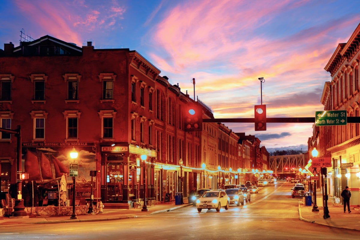 downtown norwalk at sunset with blue and pink sky