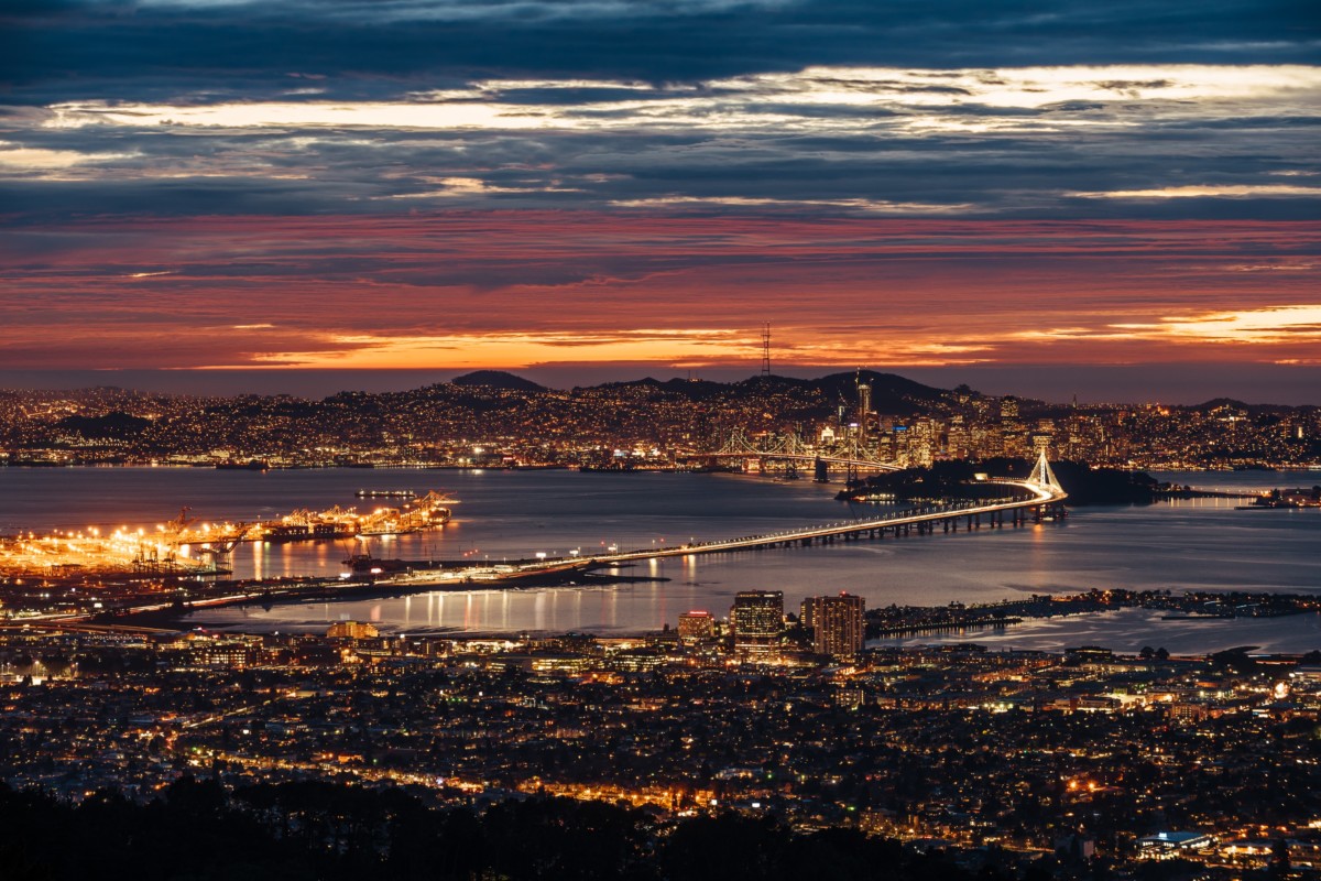 oakland california skyline and bridge at night