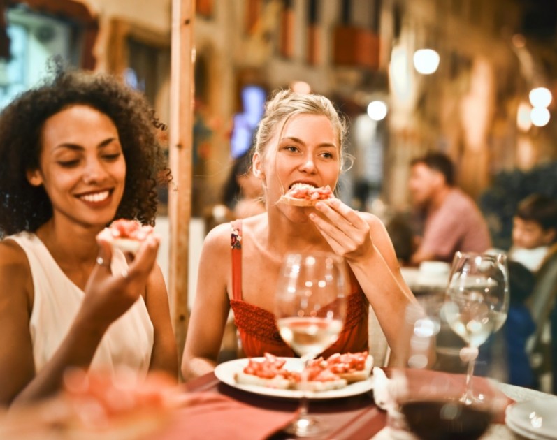 Two people eating at a restaurant