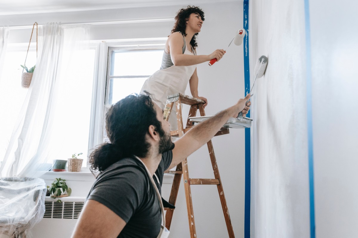 Couple completing pre-listing preparations to increase the appeal of their home