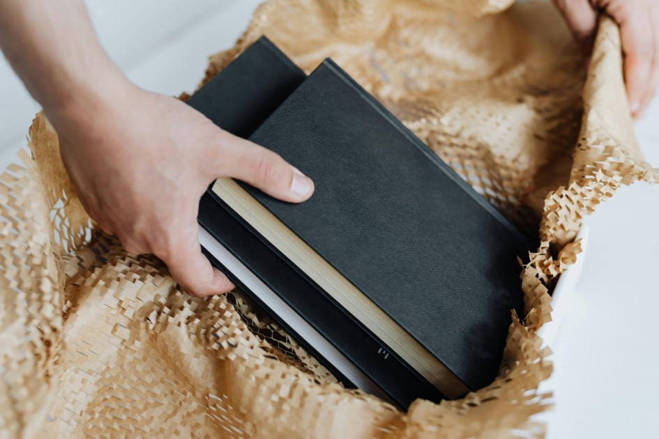 Hardcovers: Wrap with soft items or paper if they’re collectible or in delicate condition.
