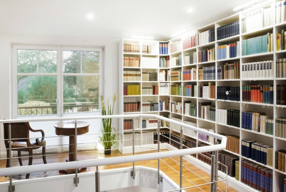 An entire wall filed with bookshelves, creating a wallpaper effect