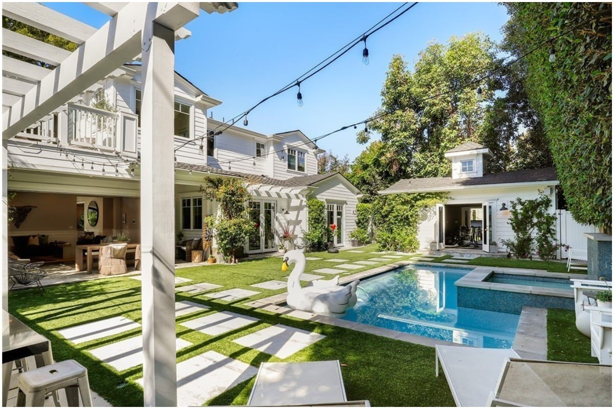 backyard with a pool and pergola