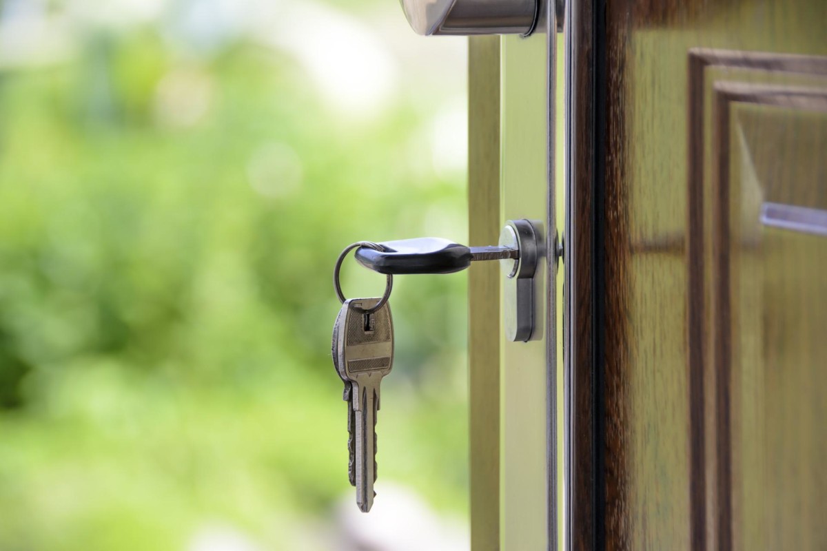 house keys unlocking private entrance to a rented room