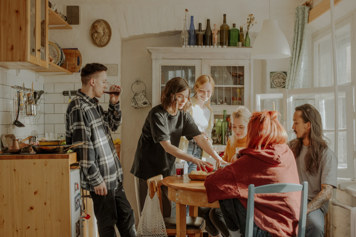Roommates gathering in the kitchen
