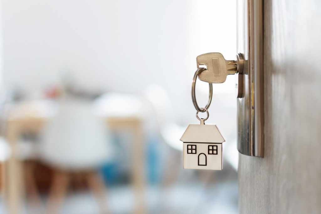 A key in the lock of a house.