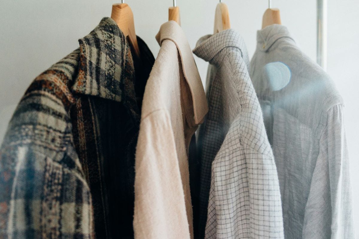 shirts hanging in a closet