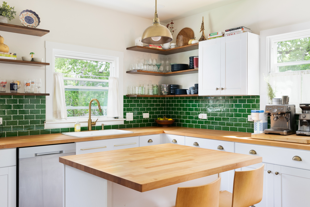 renovated kitchen with wood countertops and island